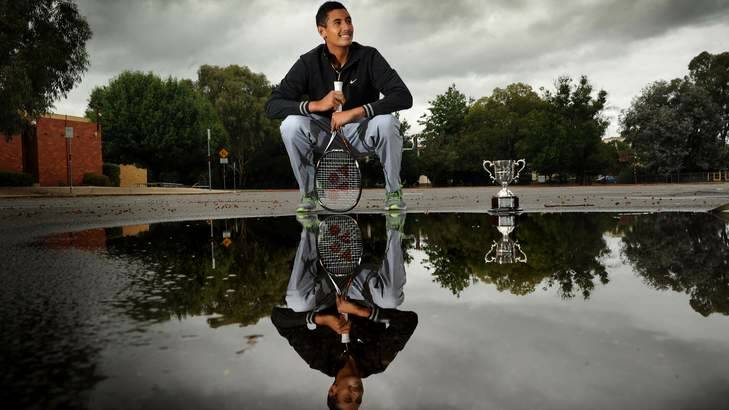 Australian Open Boys singles champion Nick Kyrgios back in Canberra today and showing off his trophy. Photo: Colleen Petch