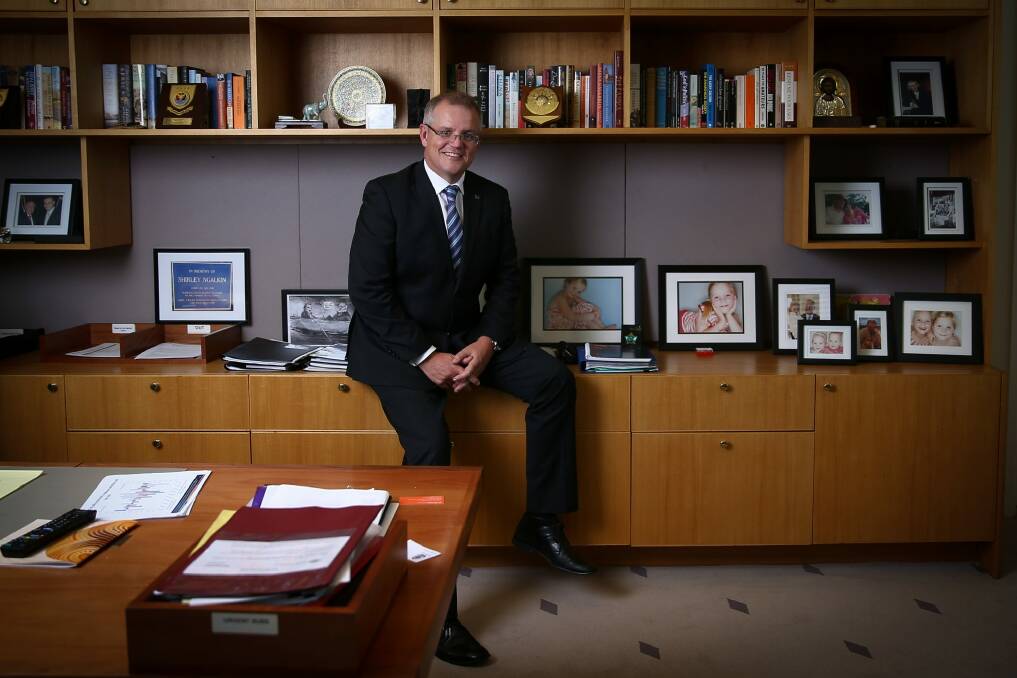Social Services Minister Scott Morrison in his office at Parliament House. Photo: Alex Ellinghausen