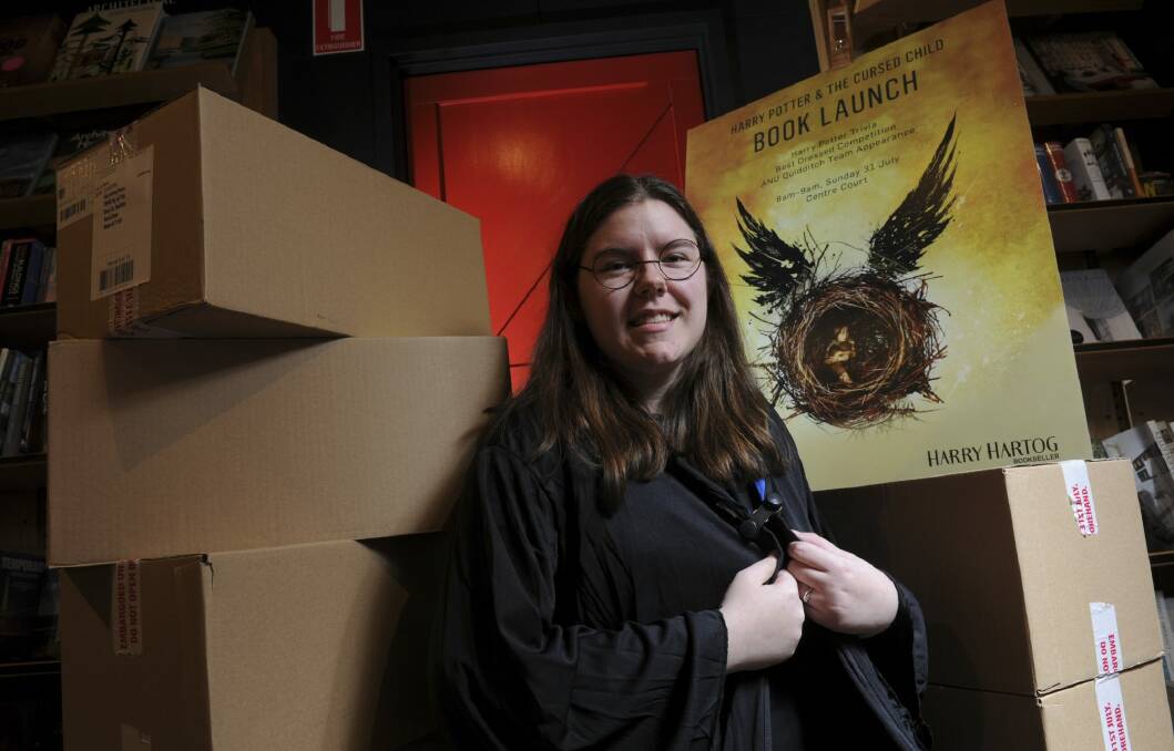 Harry Hartog store team leader Kaitlyn South stands among boxes of 'Harry Potter and the Cursed Child', with strict instructions not to open them until 9.01am on Sunday. Photo: Graham Tidy