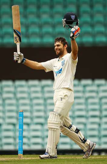 Ryan Carters of the Blues celebrates scoring his century during day two of the Sheffield Shield match against Queensland. Photo: Matt King