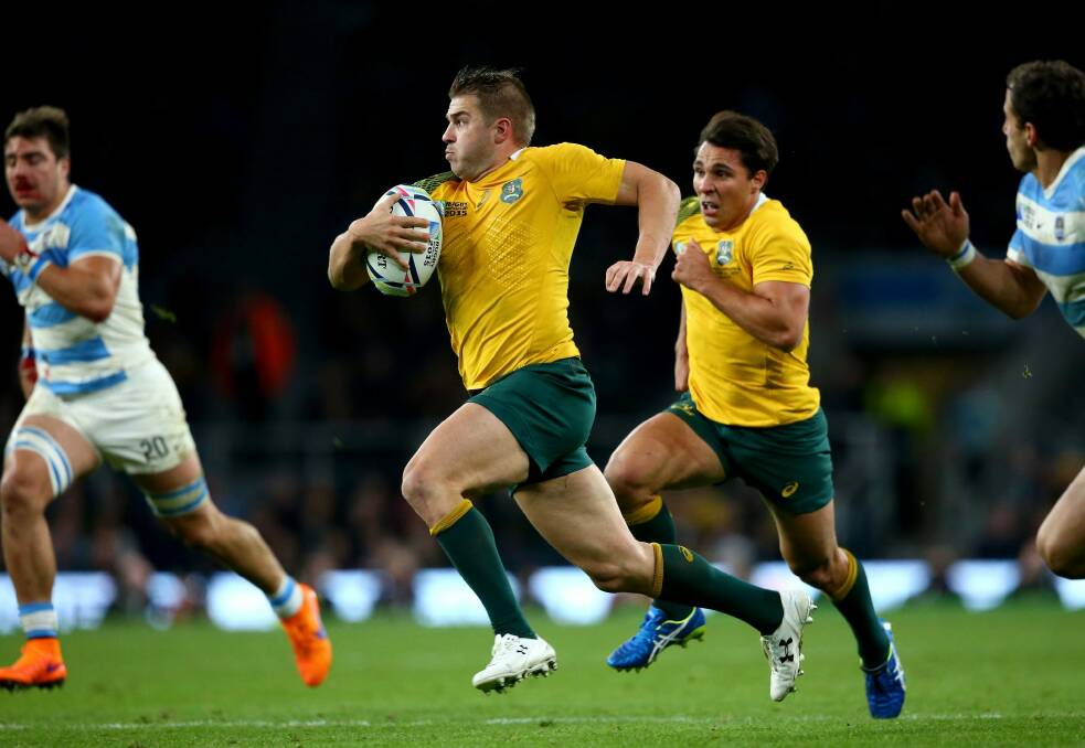 Drew Mitchell makes a break which leads to his side's fourth try scored by Adam Ashley-Cooper. Photo: Getty Images