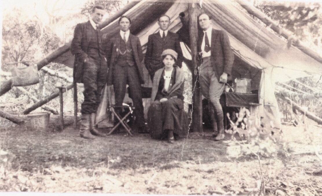 Harry Mouat, left, with fellow surveyor Freddie Johnston, second left, at the end of the job surveying the ACT border; Mouat's wife Iris is in front. Photo: Althea De Salis