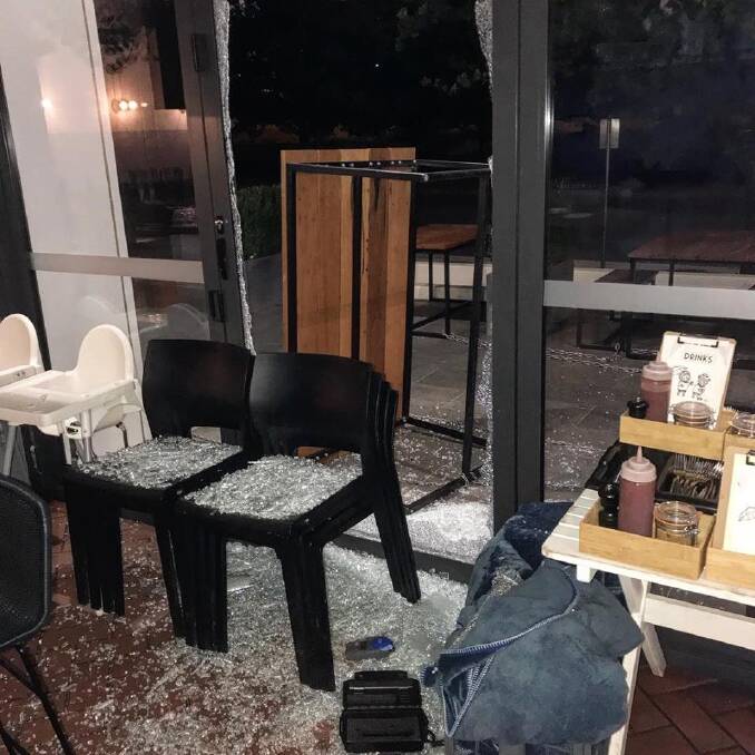 The floor at Teddy Picker's Cafe is covered in glass after thieves used a table to smash through a window during an overnight break-in. Photo: Teddy Picker's