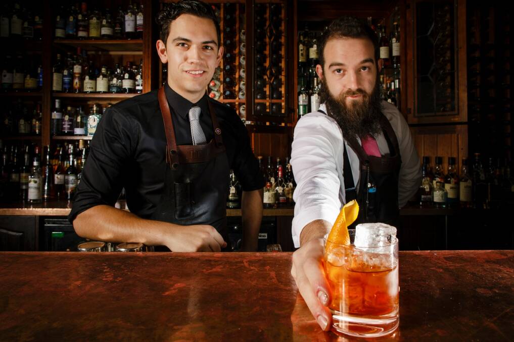 Molly bartenders Alex Gondzioulis and Zac Guertin mix an Old Fashioned. Photo: Sitthixay Ditthavong