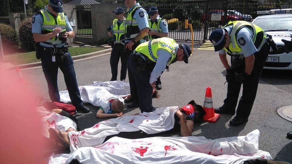 Protesters lie on the driveway outside the Indonesian embassy in Canberra. Photo: Free West Papua/Facebook