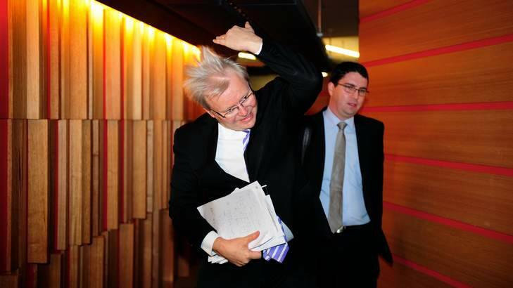 Kevin Rudd in Melbourne at Fairfax's Media House for a 3AW interview...flicking his hair. Photo: Penny Stephens