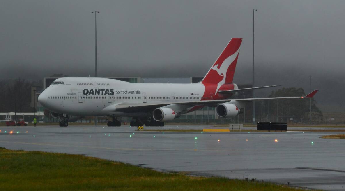 A Qantas flight from Hong Kong to Sydney was forced to divert to Canberra Airport to refuel on Sunday after storms and wet weather across NSW. Please credit  James Woodbridge Photo: James Woodbridge