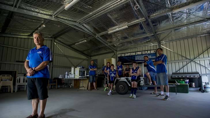 Chairman of the Gungahlin Jets Football Club Joe Cortese with the half built shed after federal government withdrew its funding support to build it. Photo: Jay Cronan