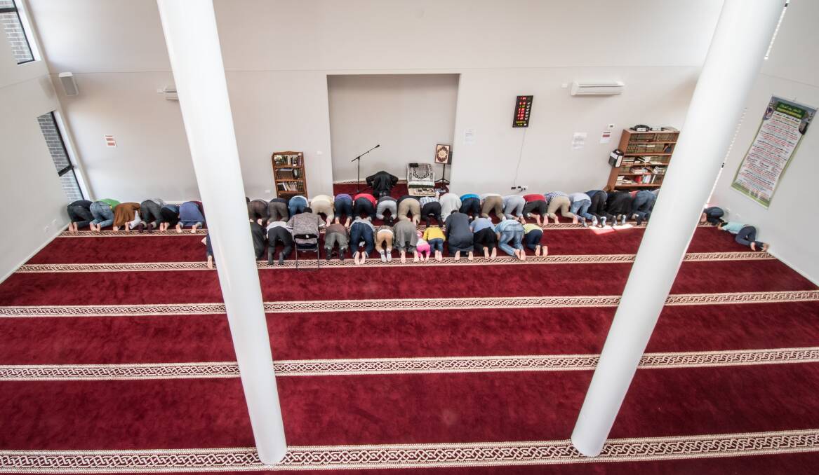 Men take part in the early afternoon prayer at Gungahlin Mosque on Saturday. Photo: Karleen Minney