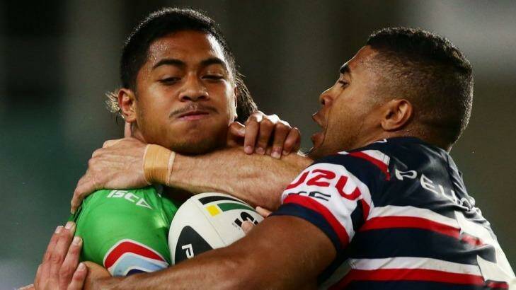 Anthony Milford cops some heavy treatment against the  Roosters on Saturday. Photo: Getty Images