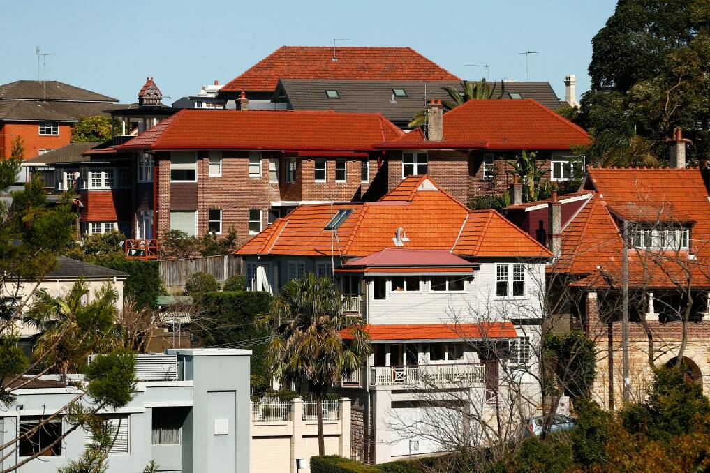 "Rising household debt and property prices in major Australian cities have created a high hurdle for the RBA to move the policy rate from its current record low of 1.5 per cent," PIMCO said. Photo: Bloomberg