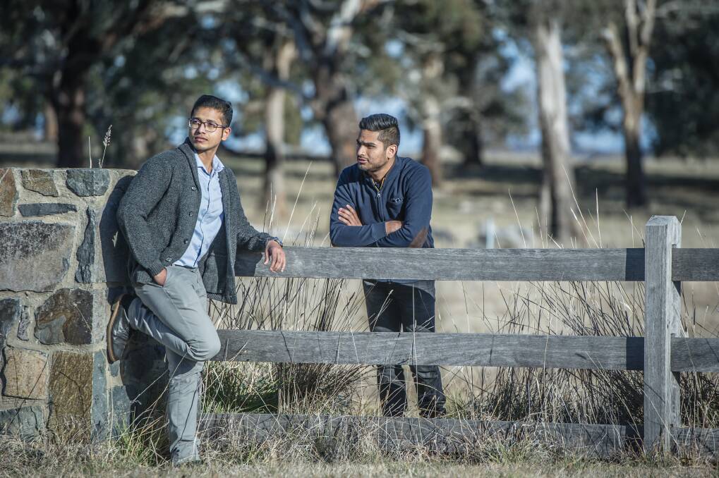 Chandan Paul, left, of Bangladesh and Yatin Malik of India and other prospective migrants have had their hopes of permanent residency in Australia dashed by ACT changes to visa rules.  Photo: Karleen Minney