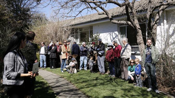 Crowd at the auction of 11 Hyde Place in Hughes, sold at auction for $905,000. Photo: Jeffrey Chan