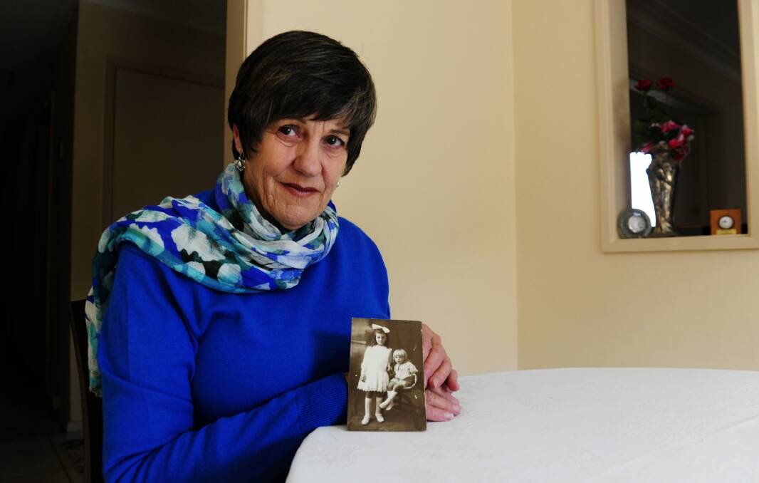 Carole Barry, of Campbell, holding a photo of Eunice Freebody, who survived a house fire, and Merlin Freebody, who was Carol's father. Photo: Melissa Adams