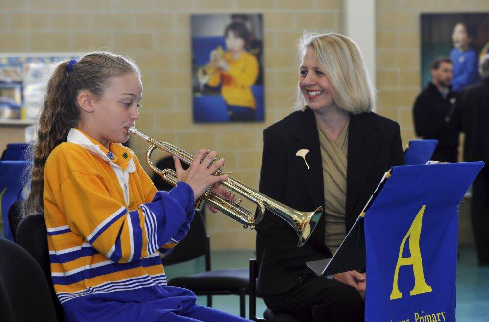Talented: Year 5 student Olivia Nattey, 10, playing her
trumpet for her mother, Sarah Nattey. Photo: Graham Tidy