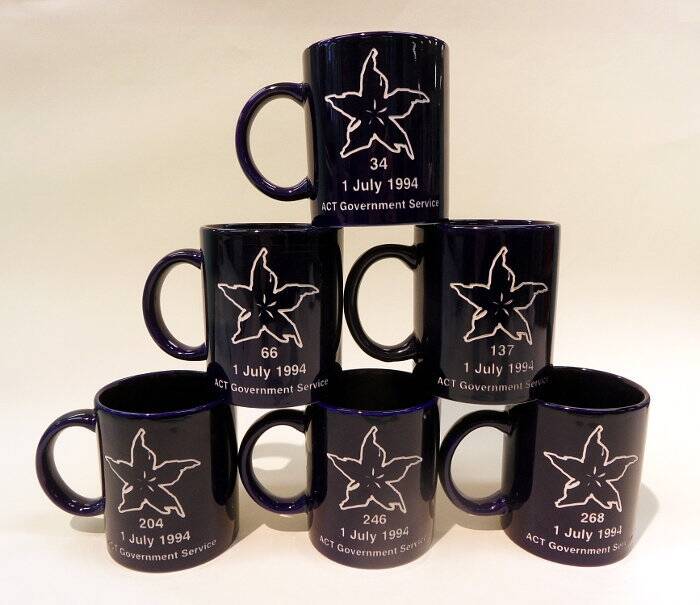 Commemorative ACT Government Service coffee mugs. Photo: Territory Records Office