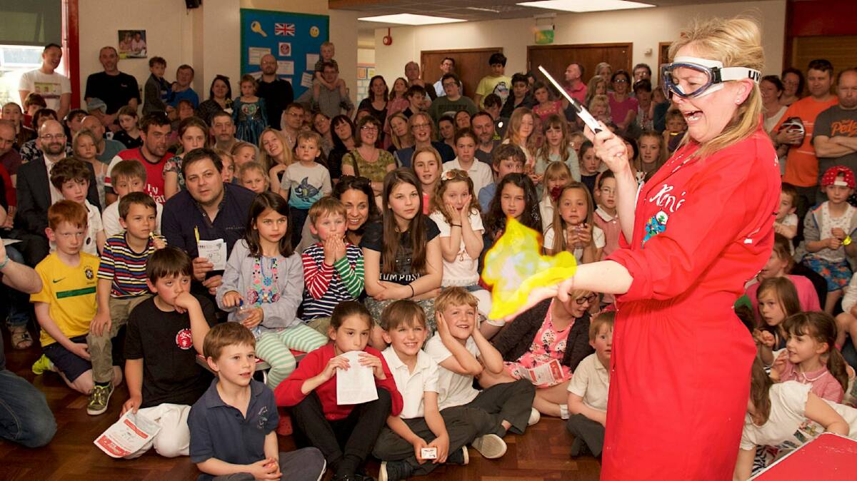 Renee conducts an experiment for a class of small science lovers in the UK. Photo: Supplied