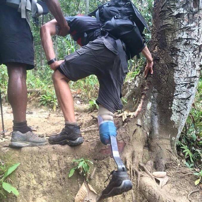 Nathan Whittington tackles an uphill section of the Kokoda trail earlier this month. Photo: Supplied
