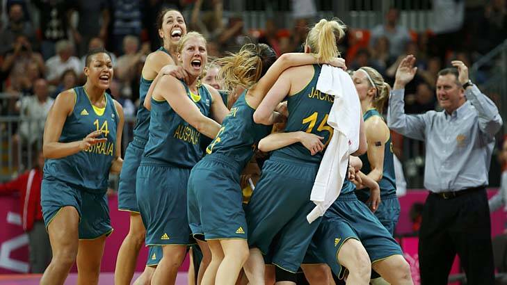 Couldn't believe it ... the Aussie players celebrate after Belinda Snell's shot. Photo: Reuters