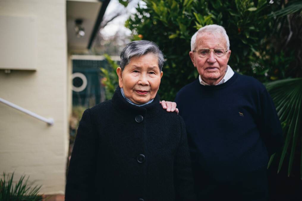 Reg and Naysin Dyett in their garden in Braddon. The rates for their townhouse have doubled since 2014. Photo: Rohan Thomson