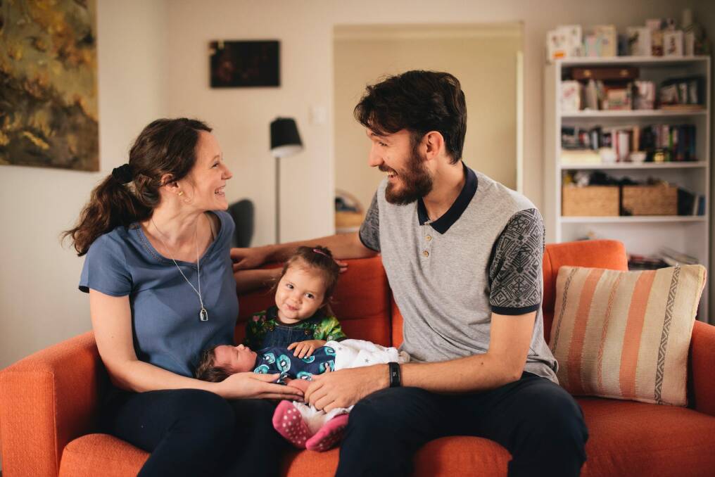 Ella Kurz and Relja Cvjeticanin with their 2-year-old daughter Frida, and newborn Ari who was born on Saturday and was the first home birth as part of ACT health's publicly funded home birth trial. Photo: Rohan Thomson