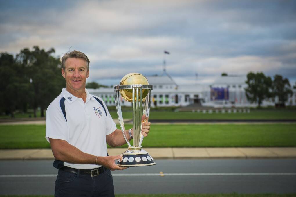 Former Australian player Andy Bichel with the ICC World Cup trophy in Canberra on Monday.
  Photo: Jamila Toderas