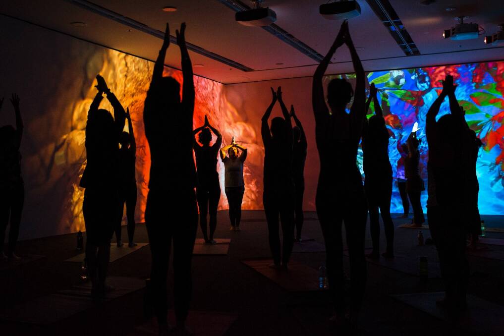 People doing yoga in the Pipilotti Risti exhibition space at the National Gallery of Australia. Photo: Jamila Toderas Photo: Jamila Toderas