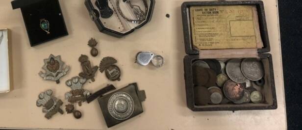 The ration book, coins and badges belonged to Lance Corporal Patrick Hannelly, 45th Battalion, WW1, who died in 1939. Photo: Hume Police District