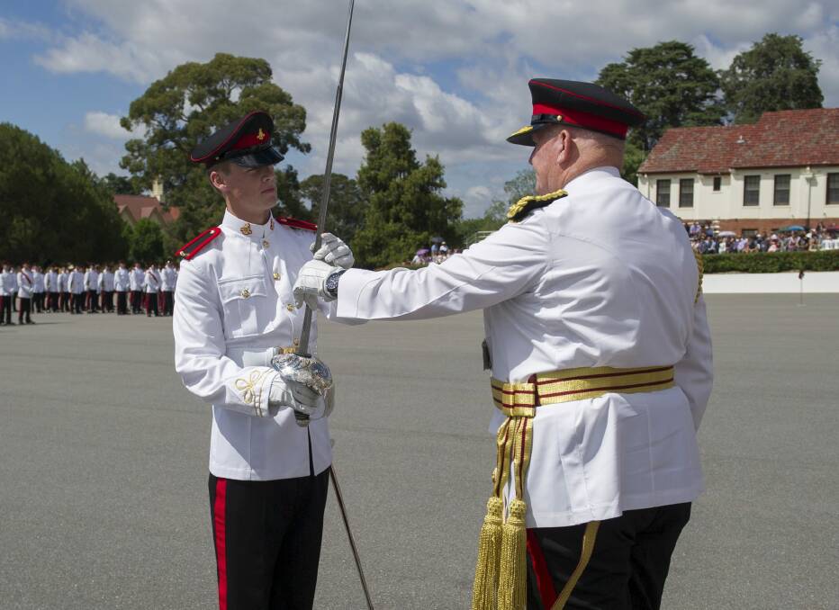 Proud moment: Senior Under Officer William Leben, left, receives the Sword of Honour from Governor-General Sir Peter Cosgrove. Photo: Grace Costa, Defence Publishing Services