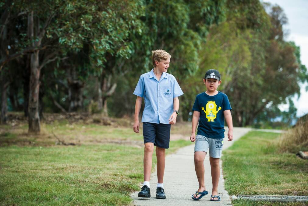 Jordan King, 15, of Hawker helped Alvin Zhao, 9, of Higgins to track down his parents after his school bus broke down. He was 5km from home and had no mobile phone.  Photo: Elesa Kurtz