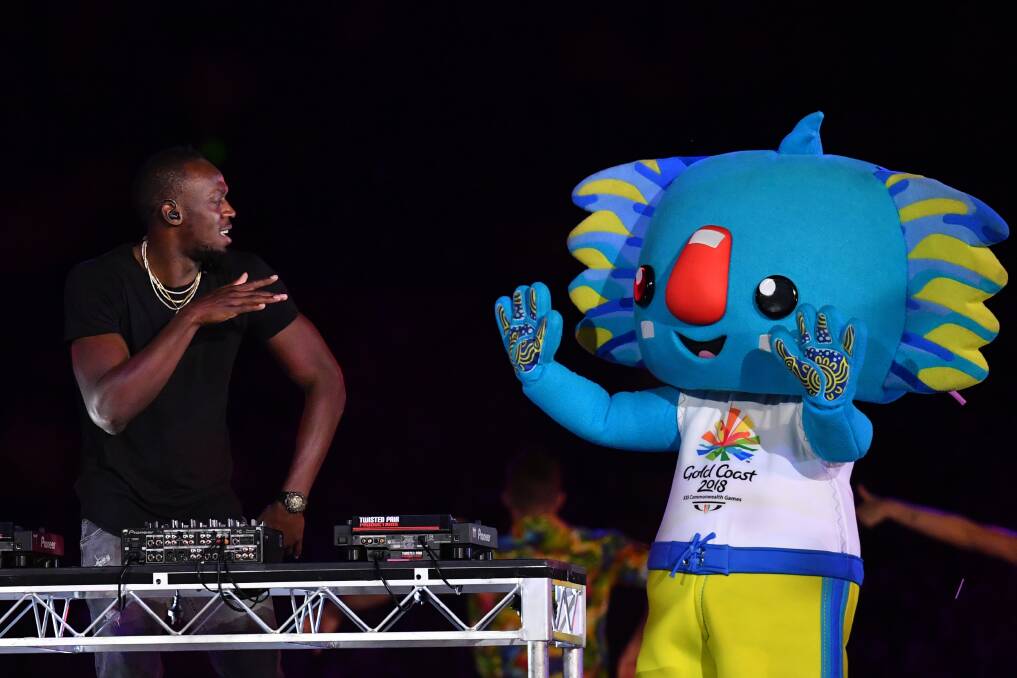 Usain Bolt performs on stage with Games mascot Borobi during the closing ceremony. Photo: AAP