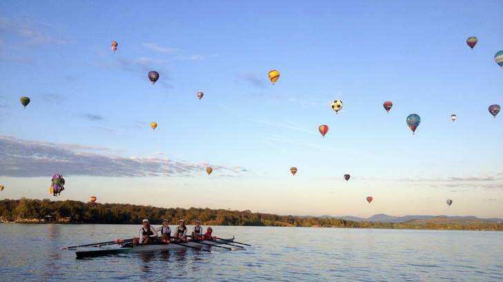 Canberra Girls Grammar School rowers on Lake Burley Griffin during Canberra's balloon festival. Photo: Jessie Glassock