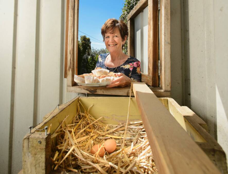 Julie Steller with her rhubarb muffins and eggs laid in their chicken run. Photo: Sitthixay Ditthavong Photo: Sitthixay Ditthavong