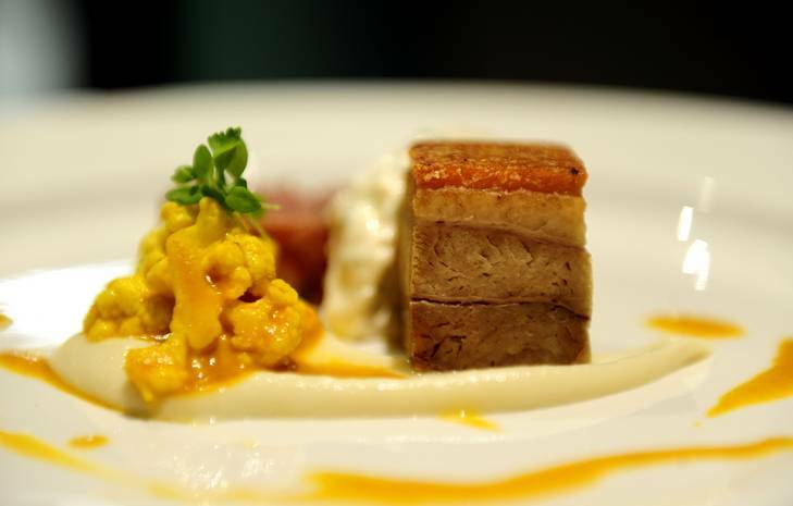 Pork-hock terrine and caramelised pork belly served with celeriac puree, piccalilli and sauce gribiche. Photo: Melissa Adams 