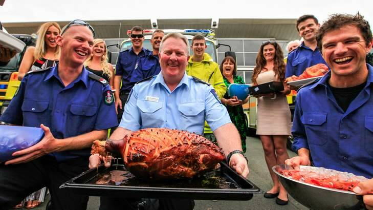 For the firefighters who work on Christmas day the Ainslie Fire Station invite all their families over for a big Christmas lunch. Rohan Coleman, Bernhard Evans and Dave Gilbert. Photo: Katherine Griffiths