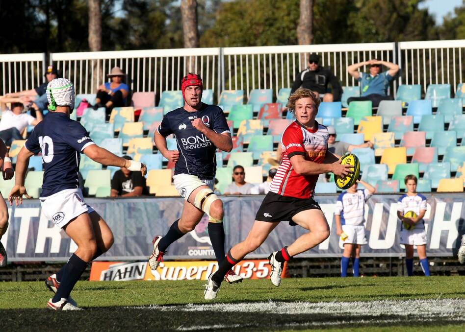 Joe Powell makes a break for the Canberra Vikings against Queensland Country. Photo: QRU/Sportography