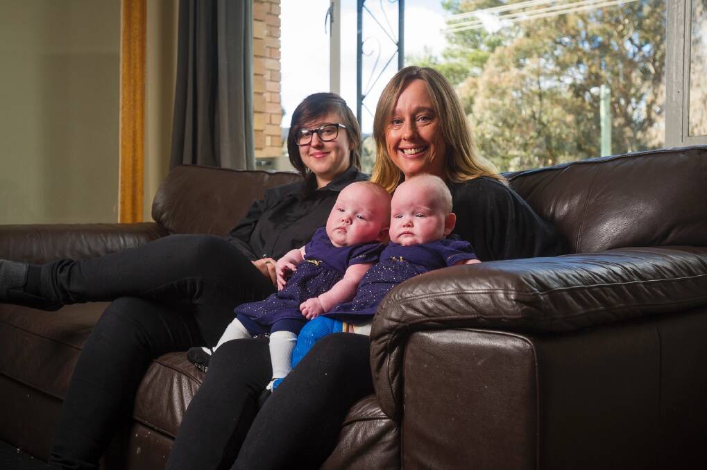 Caitlin Benson, left, Amanda Taylor and 4 month old twins Lucy Taylor and Lili Taylor.  Photo: Dion Georgopoulos