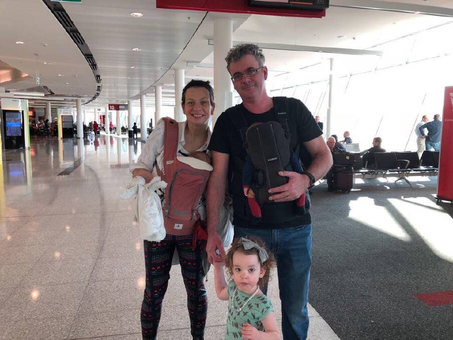 Karen Barlow and James Massola at Jakarta airport with children Sabina and twins Carlo and Giacomo. Photo: Supplied