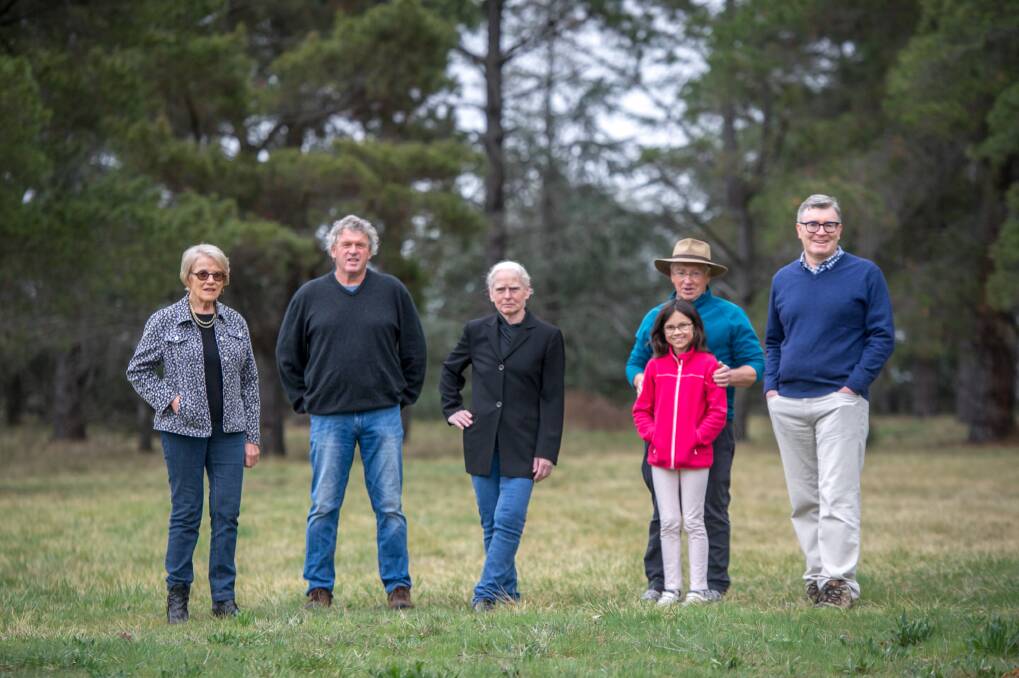 Yarralumla residents worried about planned roadworks across golden sun moth habitat to provide access to the new brickworks housing estate, from left Gwen Jamieson, David Johnstone, Dr Diana Wright, Peter and Nina Pharoah and David Harvey. Photo: Karleen Minney.