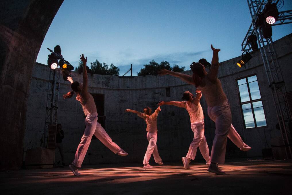 Australian Dance Party members perform in the burnt-out dome at Mount Stromlo. Photo: Lorna Sim