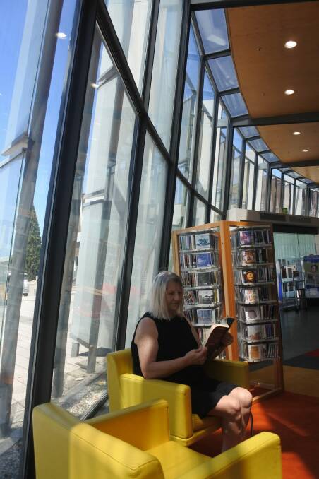 Mila Misic finds a quiet corner in the Civic library on Library Lovers Day on Wednesday. Photo: Megan Doherty