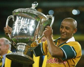 Wallabies legend: George Gregan with the Bledisloe Cup after a 16-14 win over New Zealand in 2002. Photo: Reuters