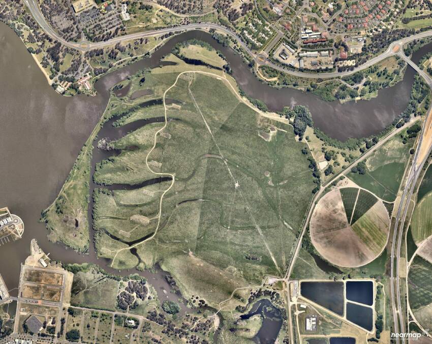 Recent aerial photo of the Jerrabomberra Wetlands which still clearly shows the old diversion channel running north-south and the scroll bars and palaeochannels running east-west. As points of reference, the Kingston Foreshore Development is at bottom left and the large circular feature at far right is the turf farm, located adjacent to the Monaro Highway, Fyshwick. Photo: TAMS