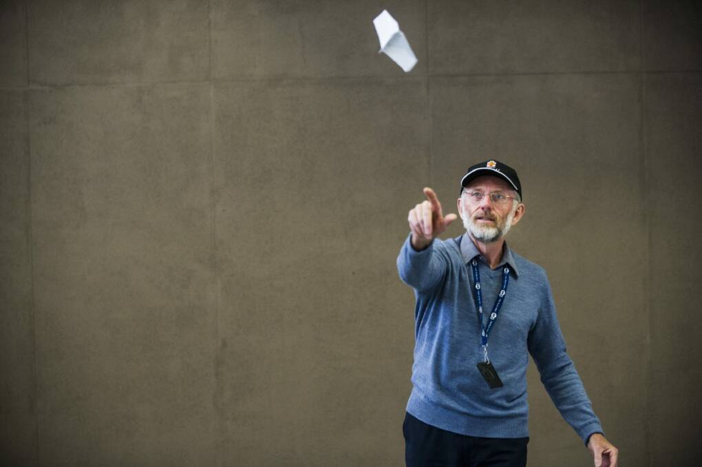 Dr Warren Smith's plane flew for seven seconds in the Red Bull Paper Plane air-time competition.
 Photo: Rohan Thomson