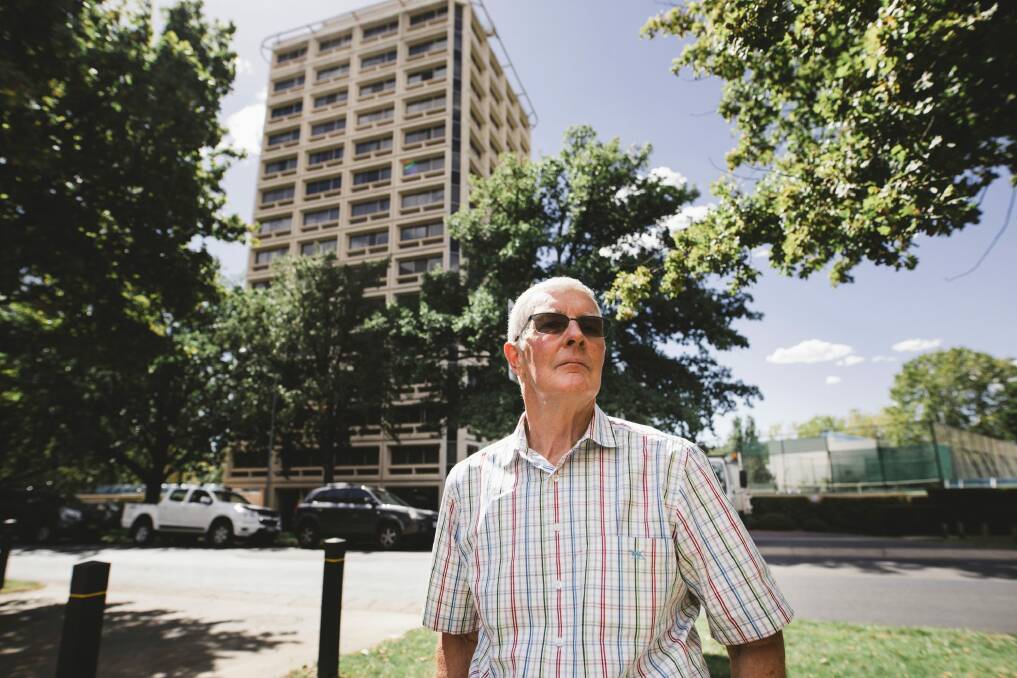 Gary Petherbridge stands in front of Kingston Tower, a building he believes was built correctly unlike developments now. Photo: Jamila Toderas