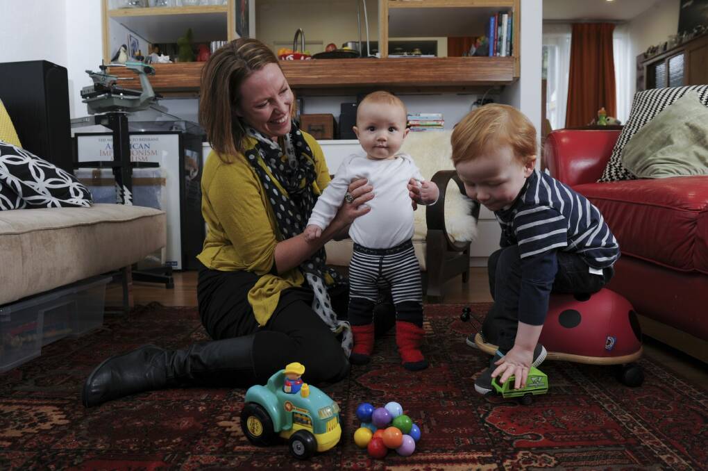 Julia Pickworth with her two boys Reuben Utley, 2, and Ignatius Utley, 6 months at their home in Belconnen. Photo: Graham Tidy