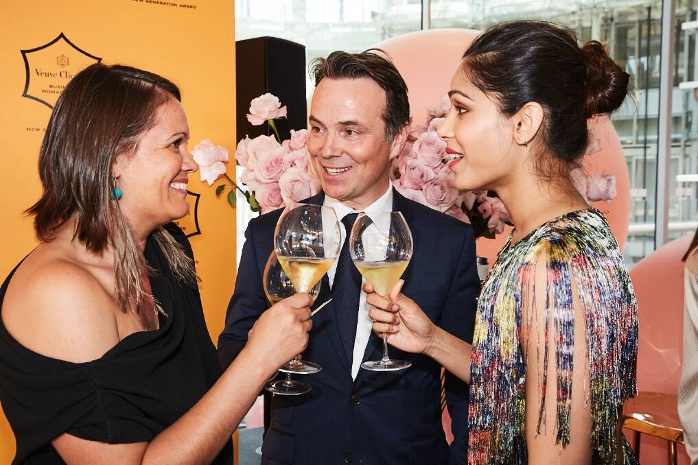 Canberra woman Mikaela Jade, winner of the a New Generation Award, sponsored by Veuve Clicquot with the champagne house's international director Thomas Bouleuc and Hollywood actress Freida Pinto. Photo: Chloe Paul