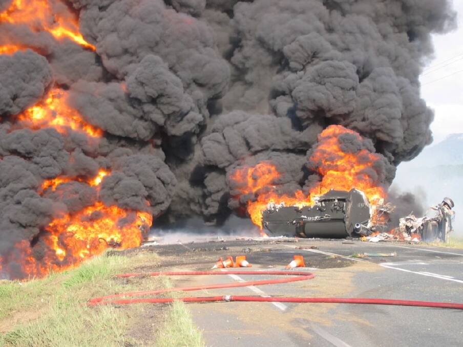 A fuel tanker bursts into flames near Mackay, Queensland, in 2004. Large freight companies are leaving it too late to train their people how to deal with such emergencies. Photo: Supplied