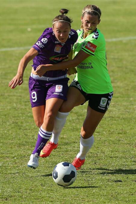 Caitlin Foord of the Glory and Stephanie Ochs of Canberra United contest the ball the last time the two teams met.