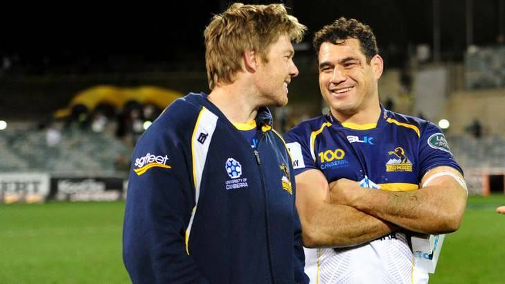 Clyde Rathbone and George Smith celebrate the Brumbies win last weekend over the Cheetahs. Photo: Melissa Adams